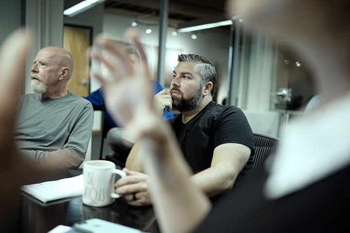 REGROUP team members listening in meeting