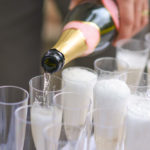 champagne being poured into glasses