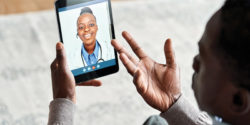 Patient virtually interacting with doctor on a tablet